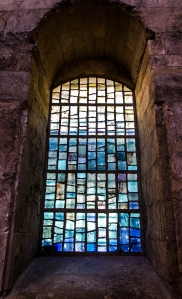 A beautiful stained glass window in the cloister.